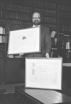 University of Georgia School of Law Dean Ron Ellington with historical Civil War-era diplomas, 1992